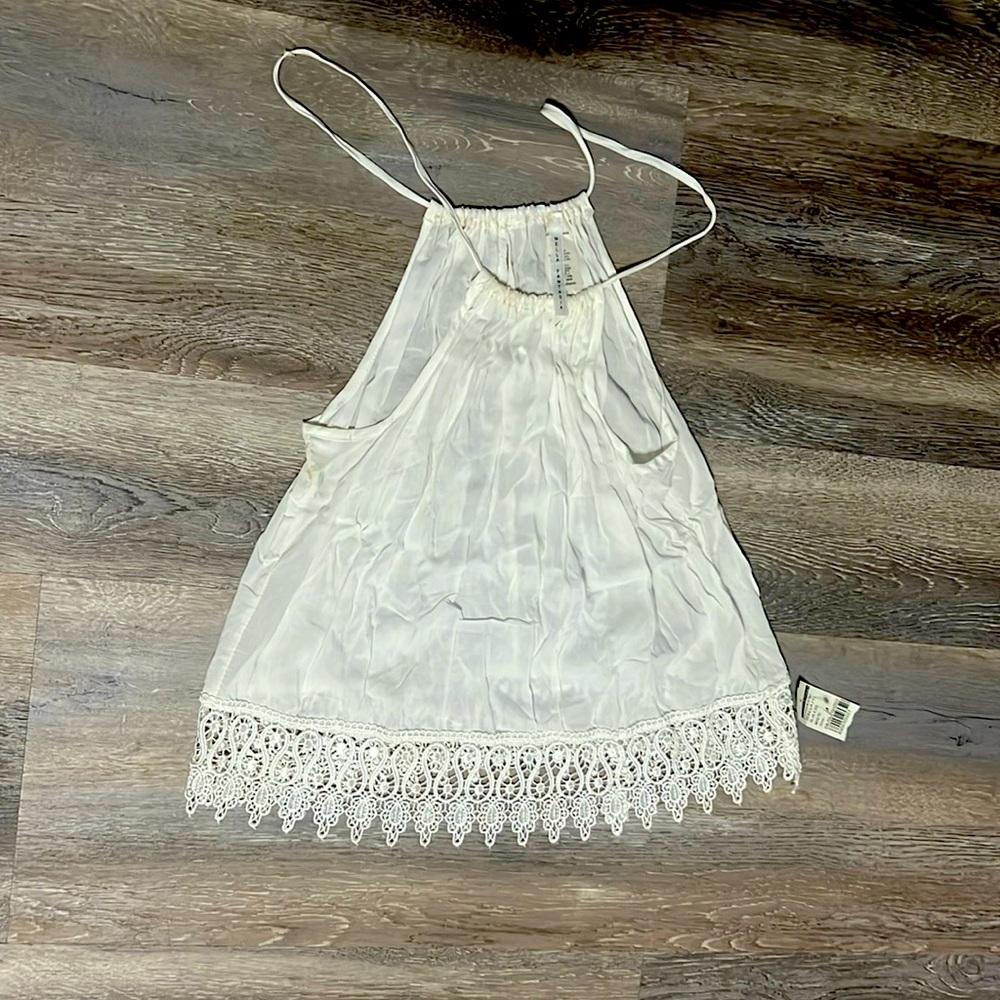 Cute tank with lace detail around bottom